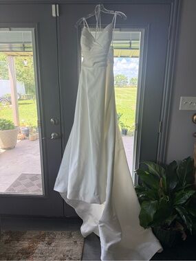 Satin White Bridal Gown with V-Neck and A-Line Skirt with Chapel Train.  Modest